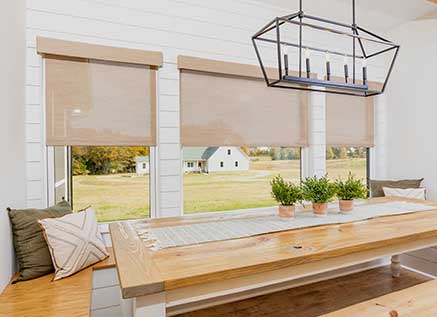 Roller Shades in a Dining Nook with Barn in Background