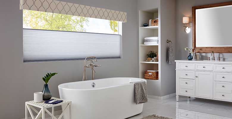 Cellular Shade in a bathroom lowered from the top